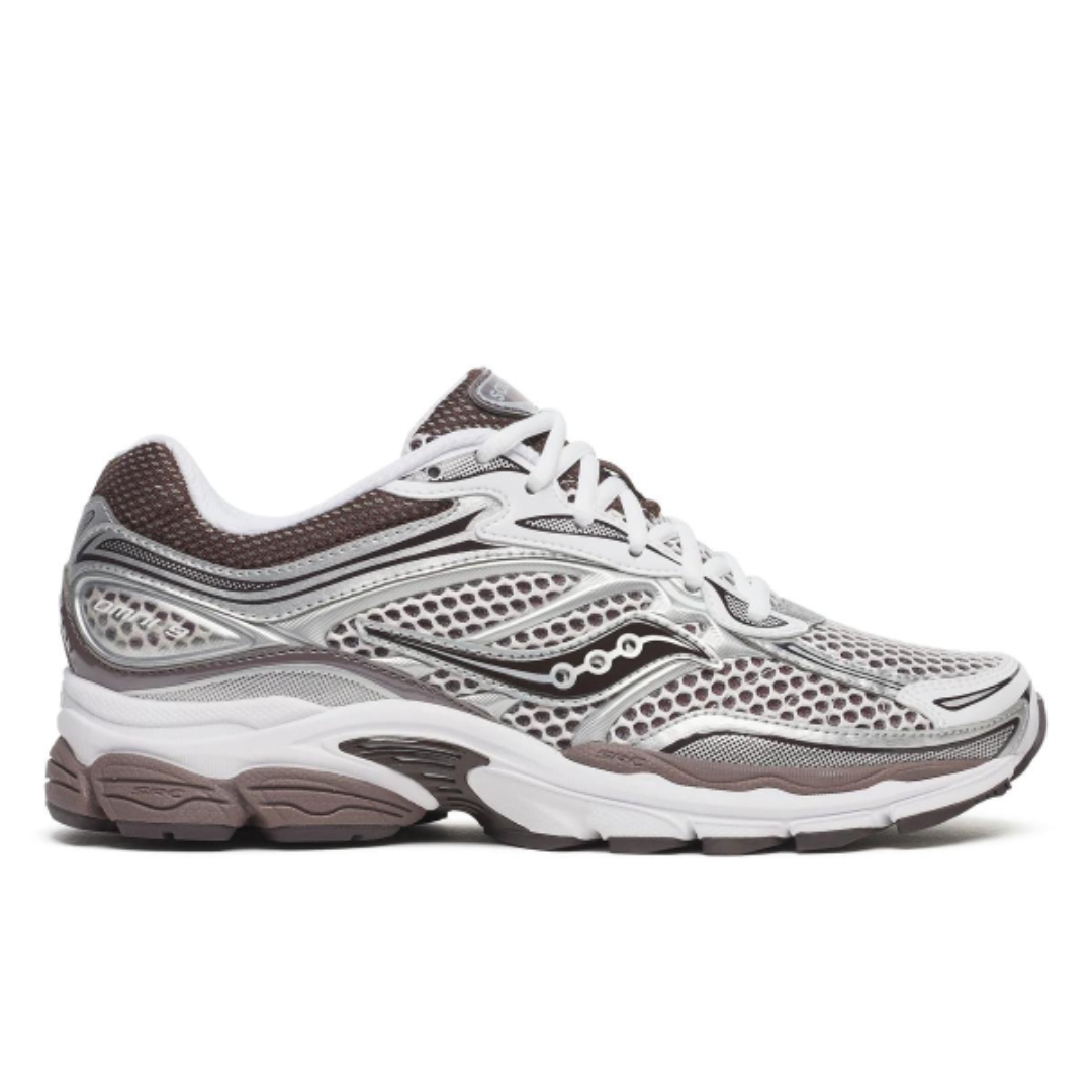 White running shoe with black and green accents on a white background